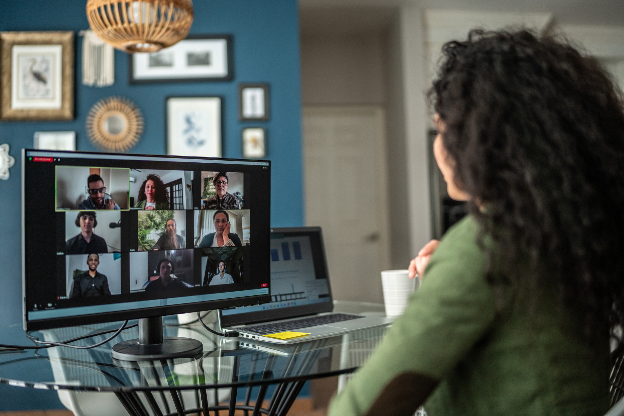 Mid adult woman during a web conference at home
